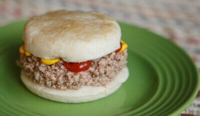 Dysphagia friendly hamburger on green plate