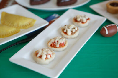 dysphagia-friendly pizza bites on white plate with footballs